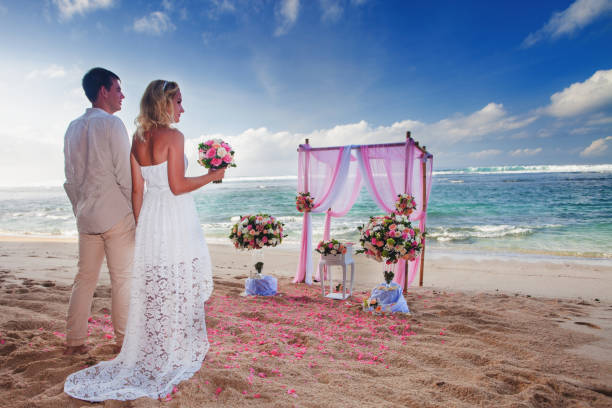 istock Wedding couple just married at the beach, Hawaii 953742298