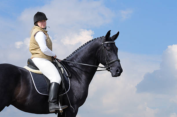 istock woman and black horse 95374279