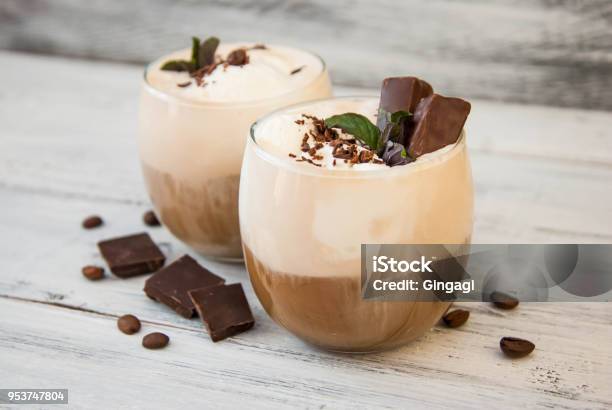 Iced Mocha Coffee With Whip Cream Summer Drinking Times Coffee Beans Rustic Textured Wooden Background Mint Leaves Stock Photo - Download Image Now
