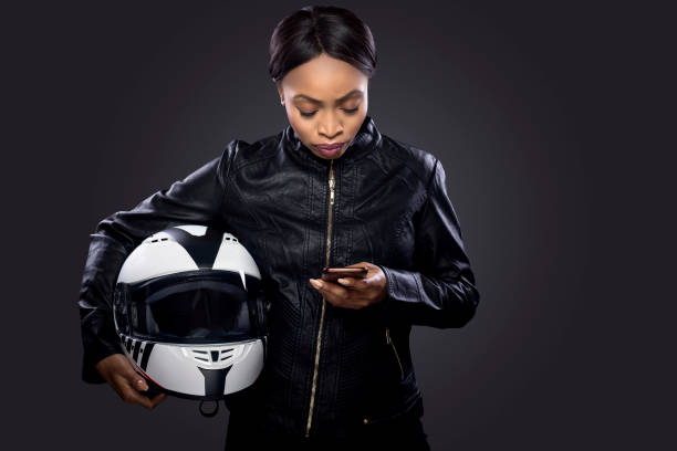 istock Female Biker Looking at GPS 953747880