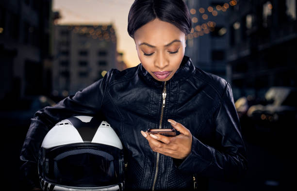 istock Female Biker Looking at GPS 953747938
