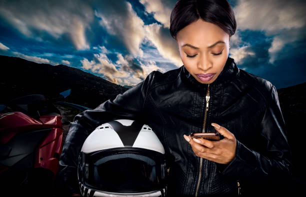 istock Female Biker Looking at GPS 953747994