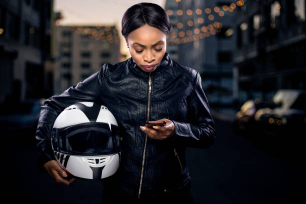 istock Female Biker Looking at GPS 953747998