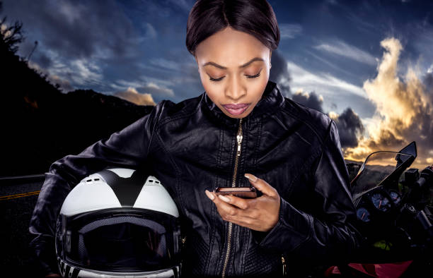 istock Female Biker Looking at GPS 953748008