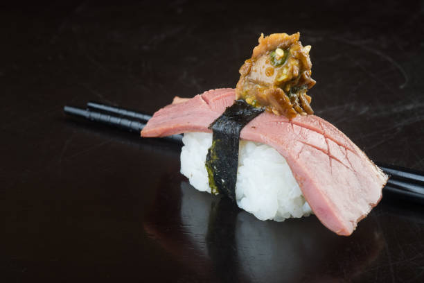 istock japanese cuisine. sushi octopus on background 953758620