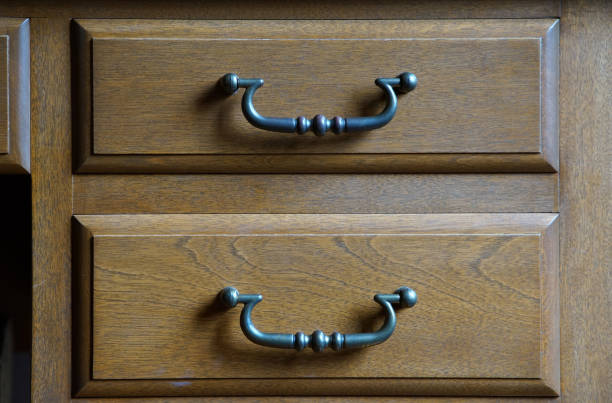 A drawer and handle of the wooden furniture