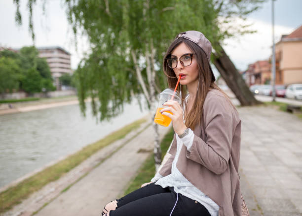 istock girl with a pattern is enjoying the sun beside the river 953762172