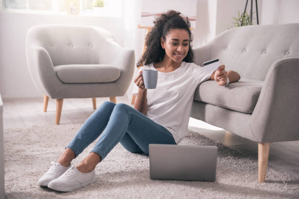 istock Pleasant joyful woman sitting on the floor 953767066