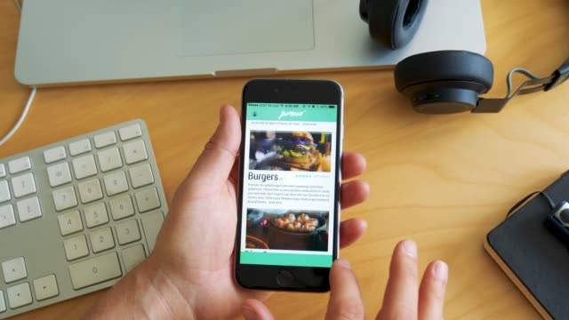 Man Orders Food with App on Smartphone