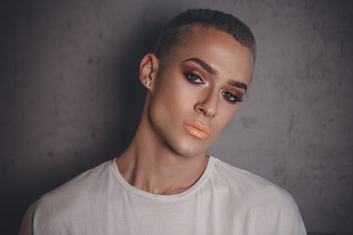 Portrait of young person posing in studio