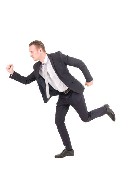 istock Businessman running forward isolated on white background 953771992