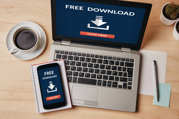 istock Free download concept on laptop and smartphone screen 953774924