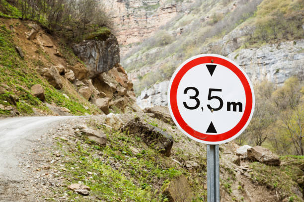 Road sign limiting altitude on a mountain road