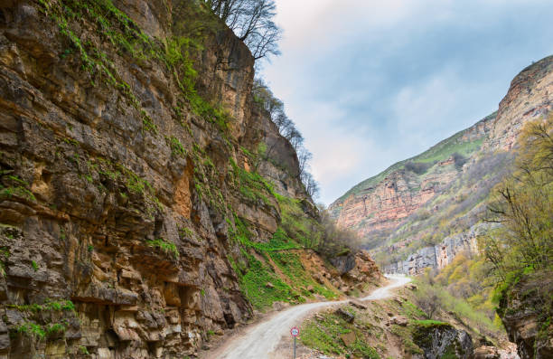 istock Narrow road in the mountains with steep slopes 953778202