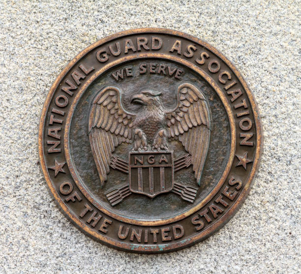 National guard association logo in bronze Beautiful close up of the logo of the American National Guard Association in bronze on granite in Normandy, France national guard stock pictures, royalty-free photos & images