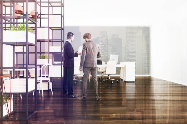 istock Gray and white office, plants, businessmen 953783316