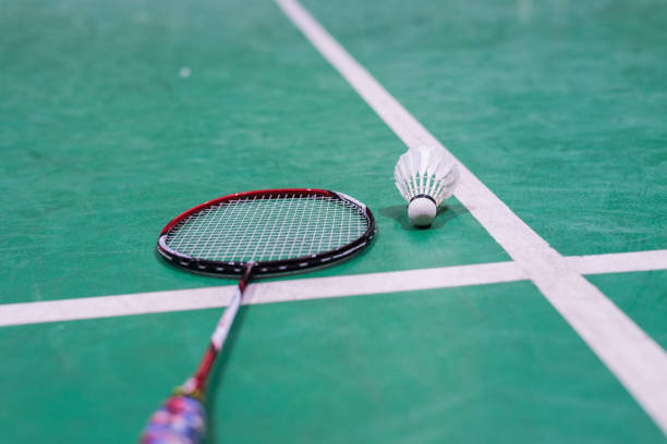 istock badminton shuttlecock and racket on court. 953787596