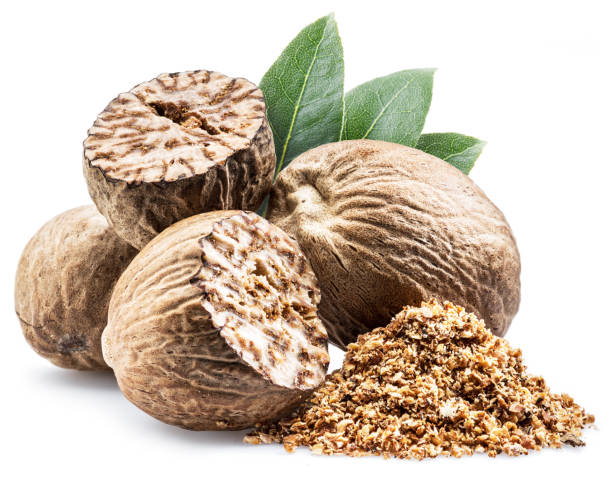 istock Dried seeds of fragrant nutmeg and grated nutmeg. 953789396