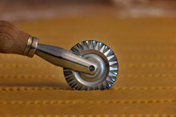 Cutter Wheel On A Puff Pastry Layer Stock Photo - Download Image