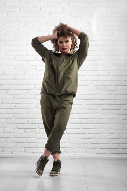 istock Exotic model demonstrating green modern sportsuit. 953794416