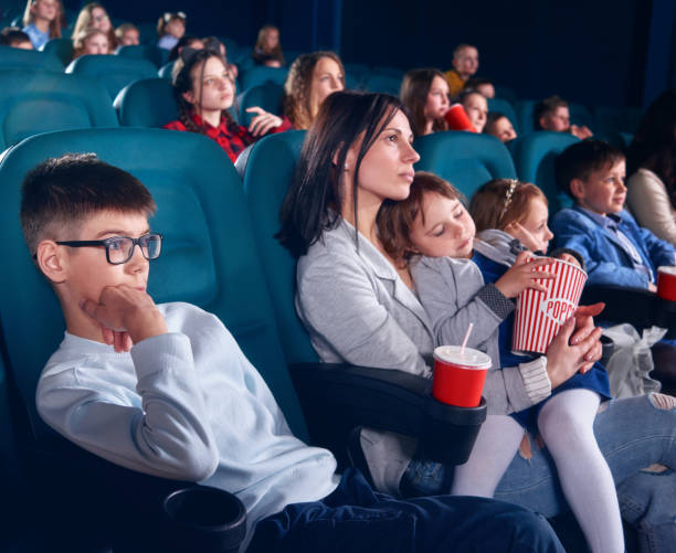 istock Viewers in cinema watching film with steadfast eyes. 953794516