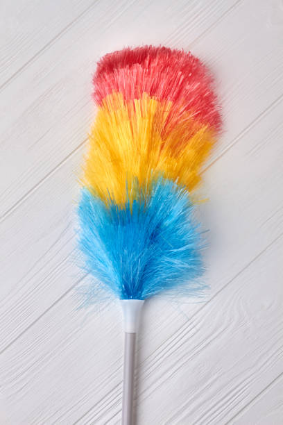 istock Fluffy duster brush on wooden background. 953795312