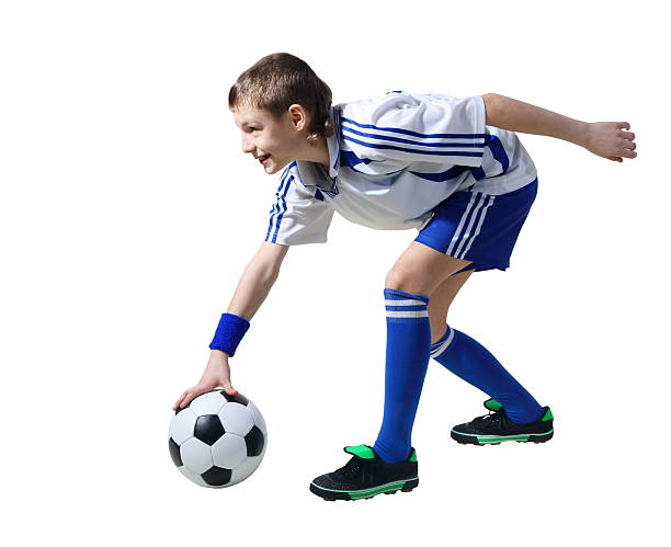 Boy with soccer ball, Footballer. (isolated) stock photo