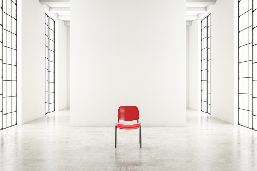 Red chair in empty white interior