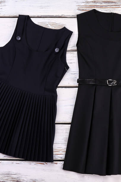istock School girls classic black dresses. 953800428