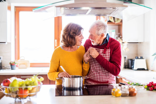 istock Happy senior couple cooking in the kitchen. 953800466