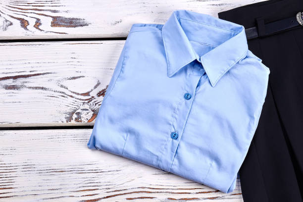 istock New folded light blue girls shirt. 953801004