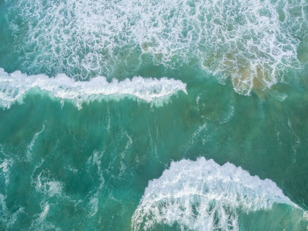 istock Large waves crushing - aerial view 953801288