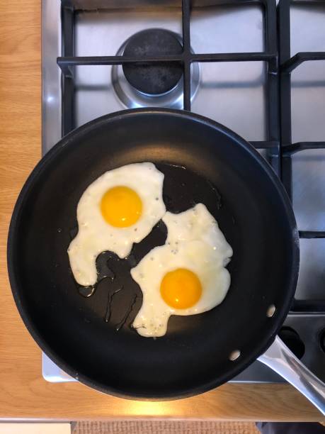 istock Two eggs in a pan on the stove 953809988