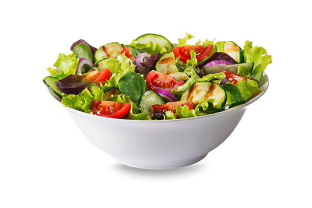 Green salad with fresh vegetables Green salad with tomato and fresh vegetables isolated on white background salad bowl photos stock pictures, royalty-free photos & images