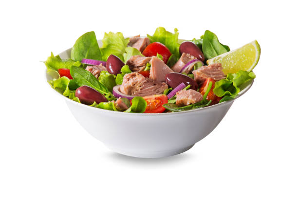 Tuna salad with lettuce, tomatoes and olives stock photo