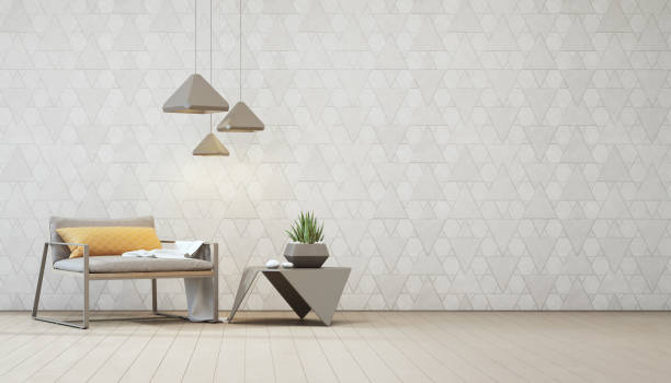 istock Indoor plant on steel coffee table and armchair with empty white triangle pattern wall background, Relaxing area in loft living room of modern house. 953815166