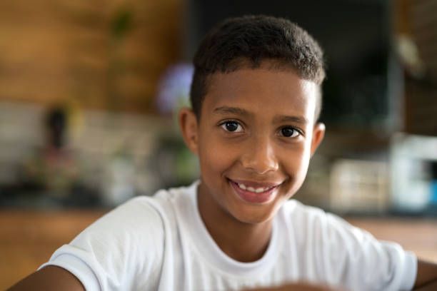 istock Cute afro boy looking at camera 953815386