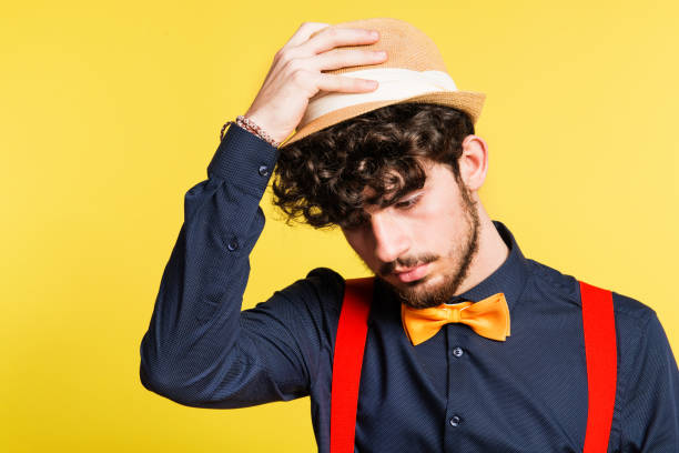 istock Studio portrait of a young man on a yellow background. 953815684