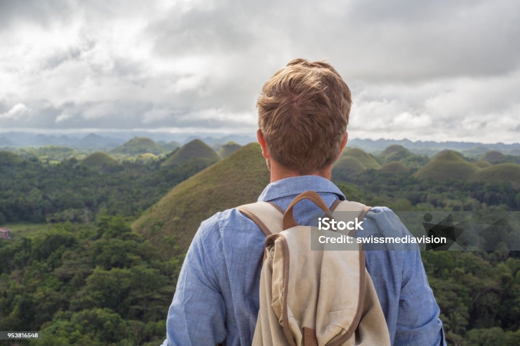 Man traveling contemplates Chocolate Hills of Bohol, Philippines Young man traveling contemplates Chocolate Hills of Bohol, Philippines
The Chocolate Hills are a geological formation in the Bohol province of the Philippines.
People travel Asia concept vacations 30-39 Years Stock Photo