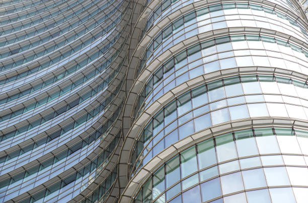 istock modern blue glass wall of office building 953818898