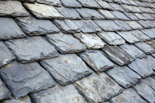 Aged slate tile roof background stock photo