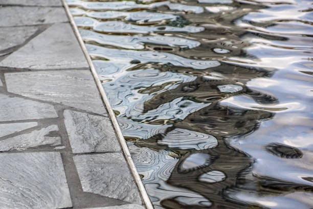 istock A drop of water on a stone that is varnished. 953819672