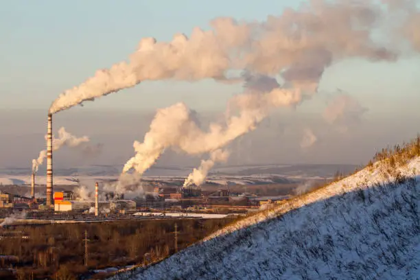 Power plant with smoke and dirty orange air