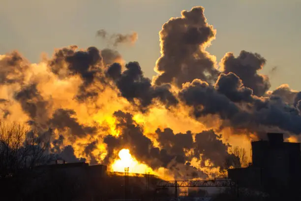 Power plant with smoke and dirty orange air