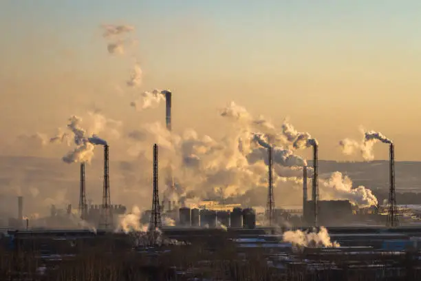 Power plant with smoke and dirty orange air