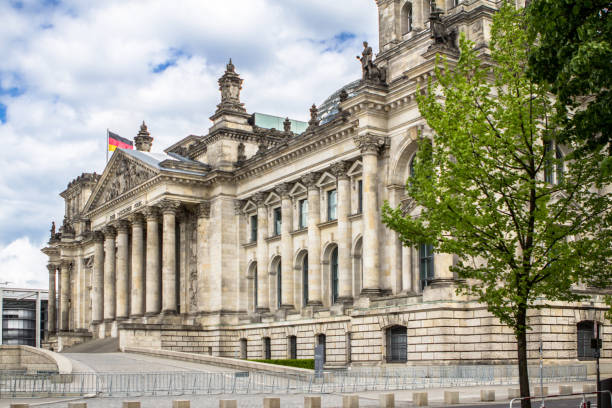 istock The Reichstag building and German flags, Berlin 953824782