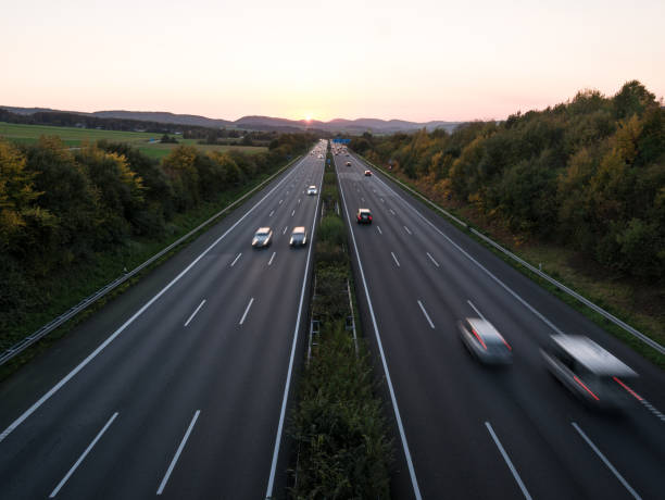 istock The road traffic on a motorway at sunset 953838348