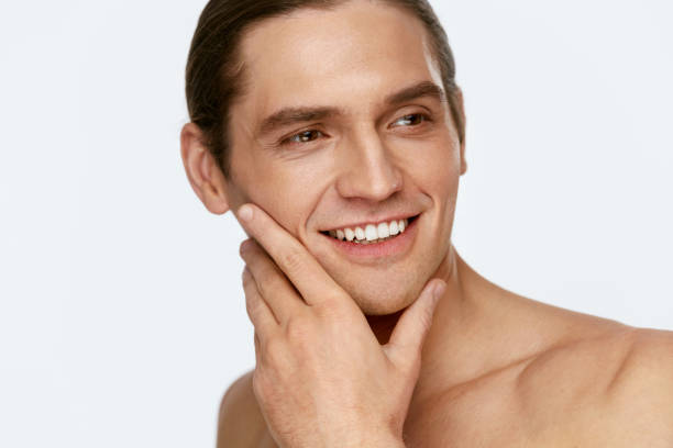 istock Men Face Care. Man Touching Smooth Skin After Shaving 953838506