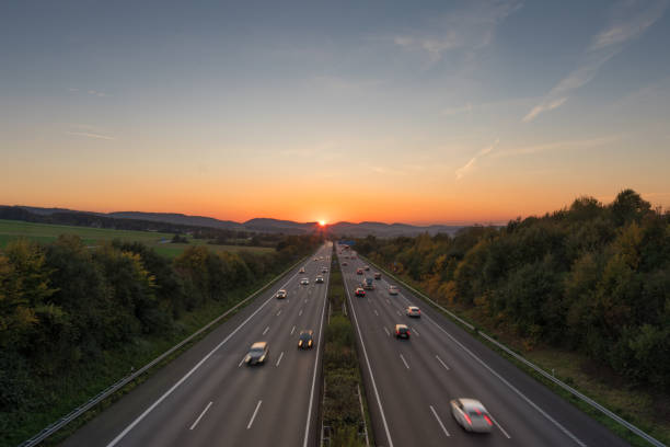 istock The road traffic on a motorway at sunset 953842848