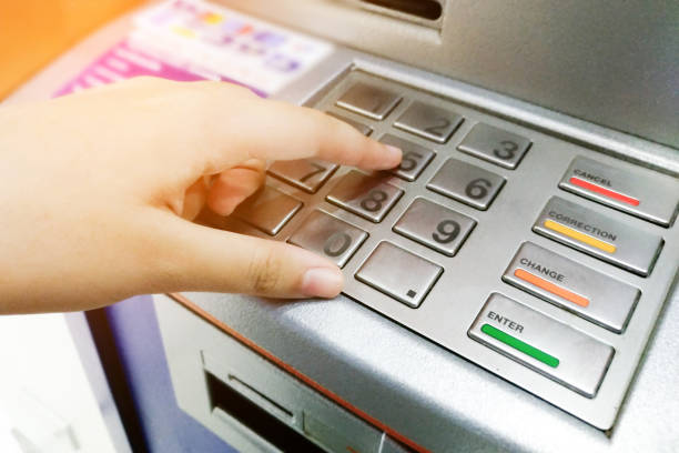 istock Woman hand entering PIN or password security code on ATM bank machine 953843128